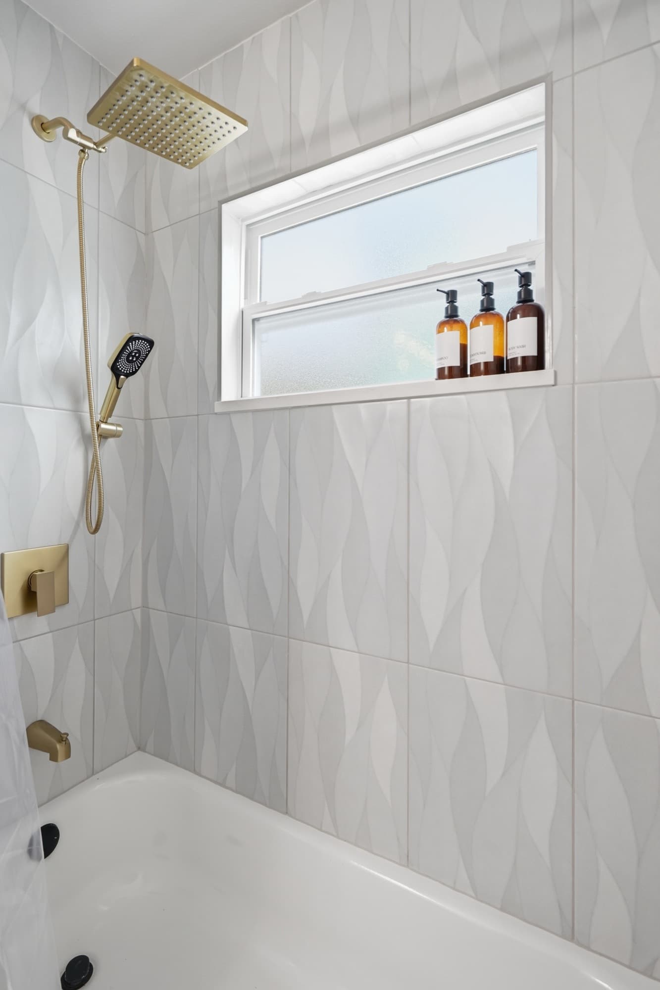 Bathroom with shower over the tub