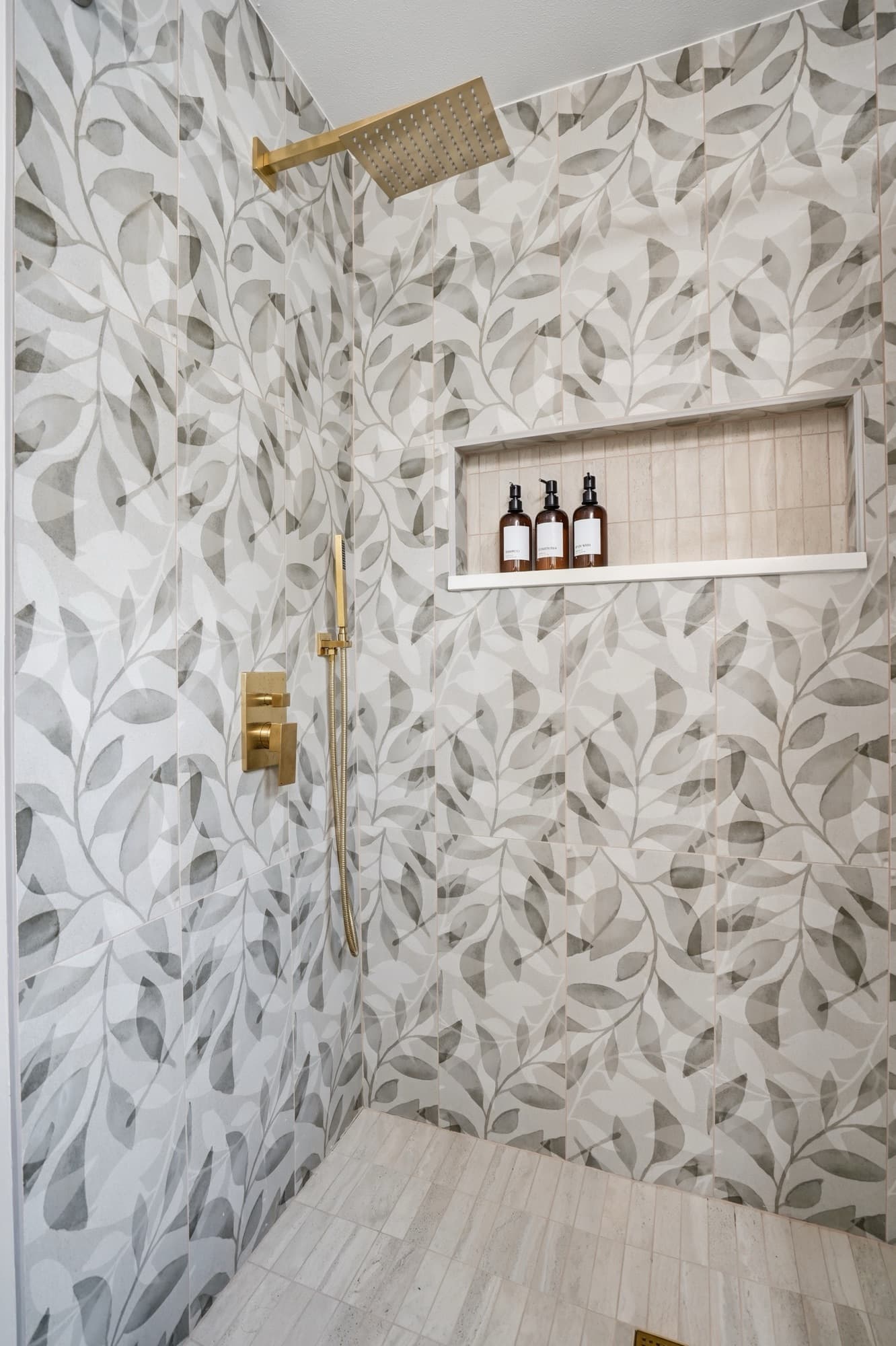 Walk-in shower with botanical tile