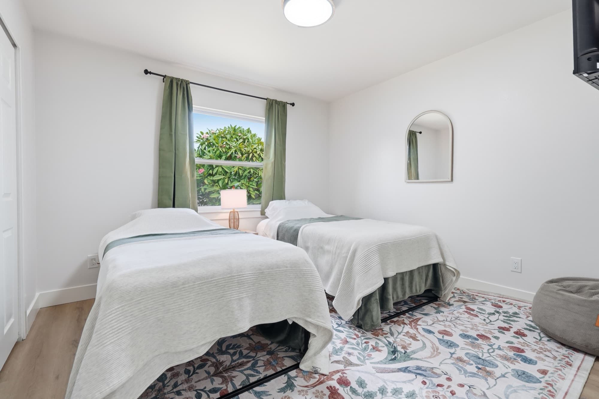 Bedroom 1 twin beds with garden view
