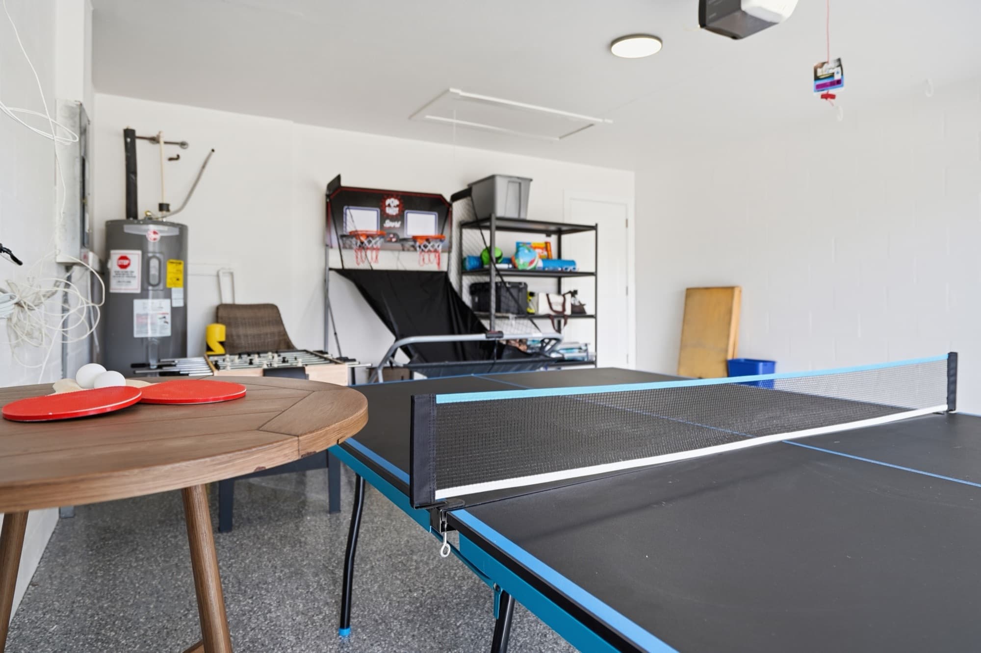 Garage game room with ping-pong table