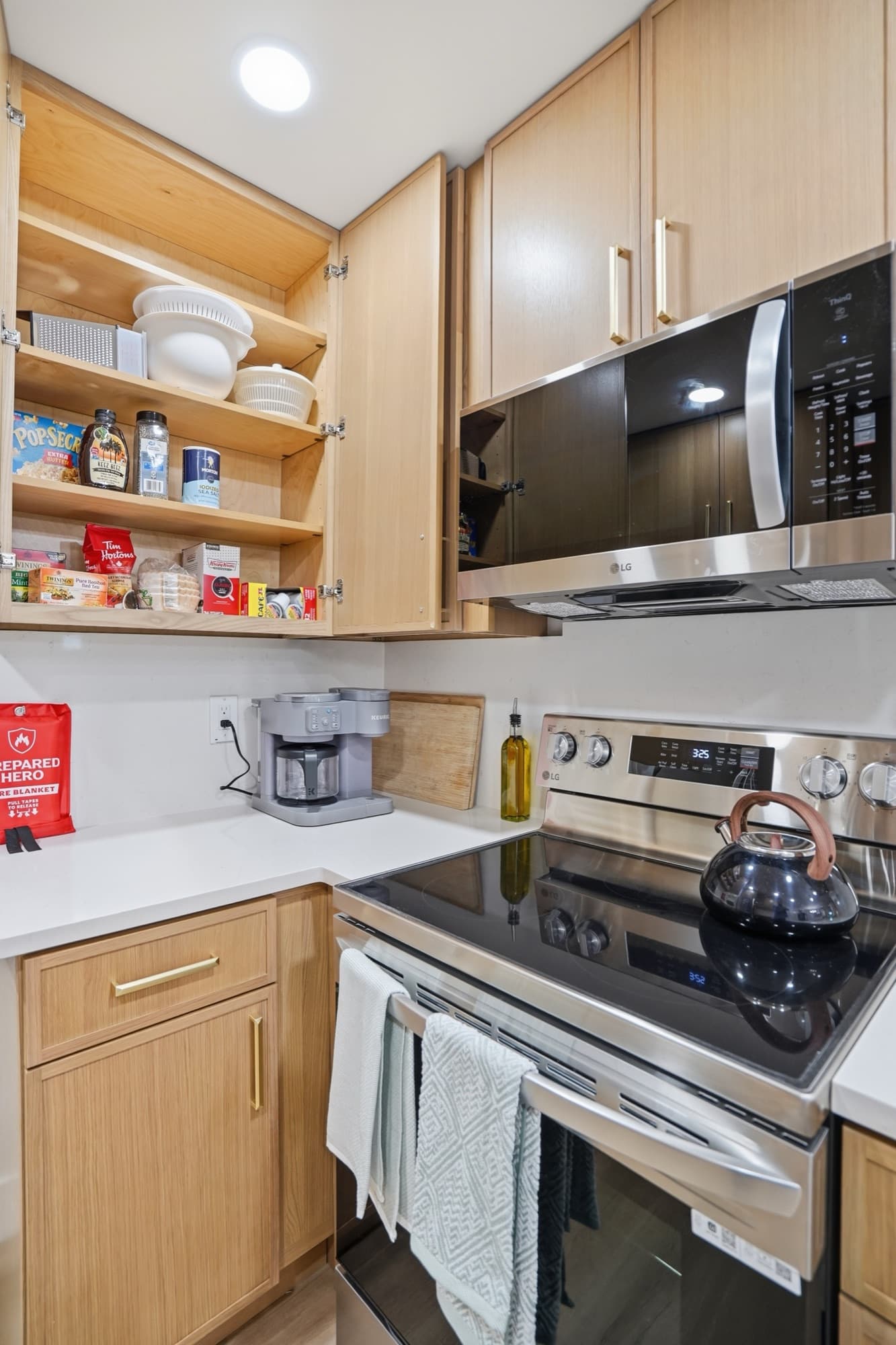 Kitchen with stainless-steel range and microwave